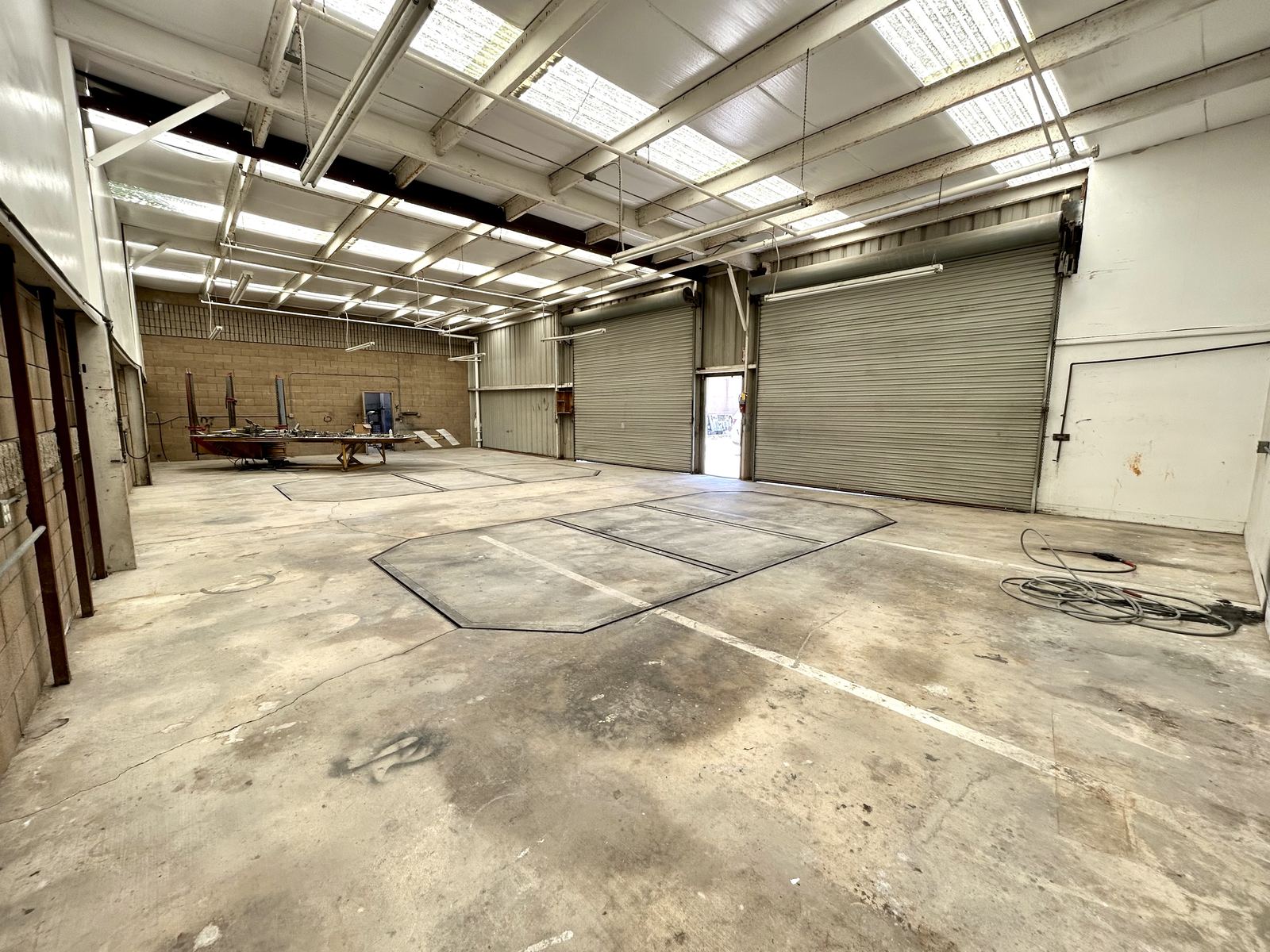 Industrial warehouse interior with roll-up doors