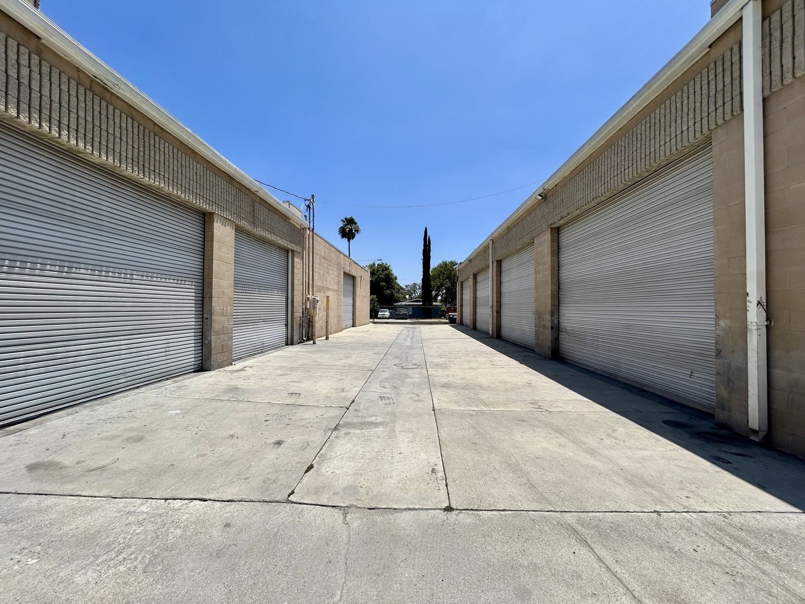 Industrial yard between roll-up door buildings